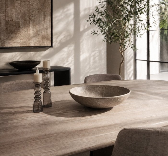 Modern minimalist table decor with ceramic bowl and glass accents